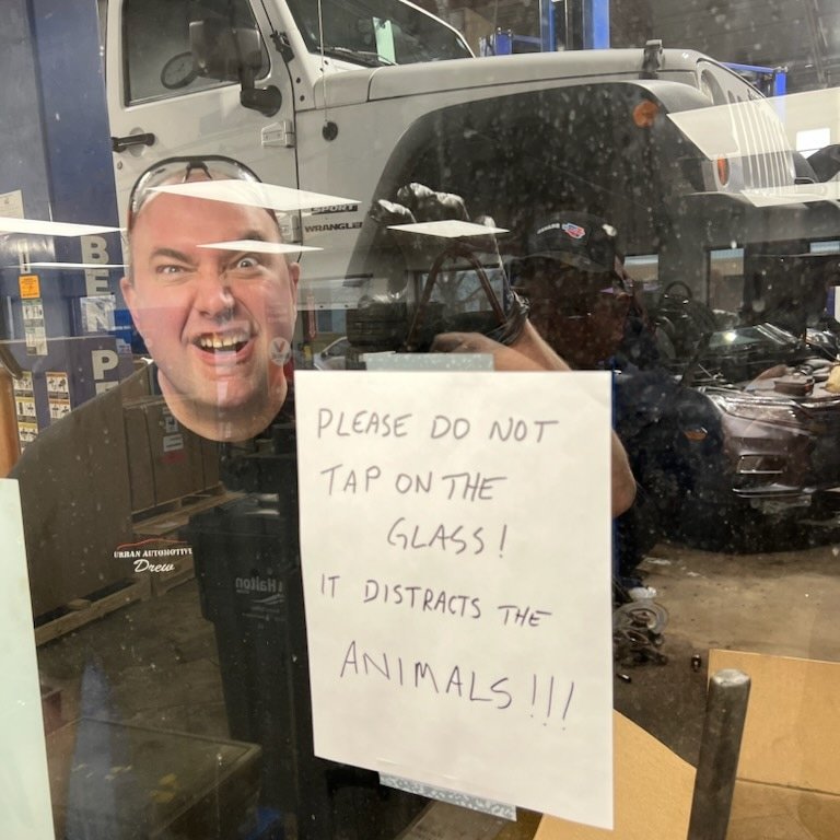 A playful sign in the Urban Automotive shop window in Oakville