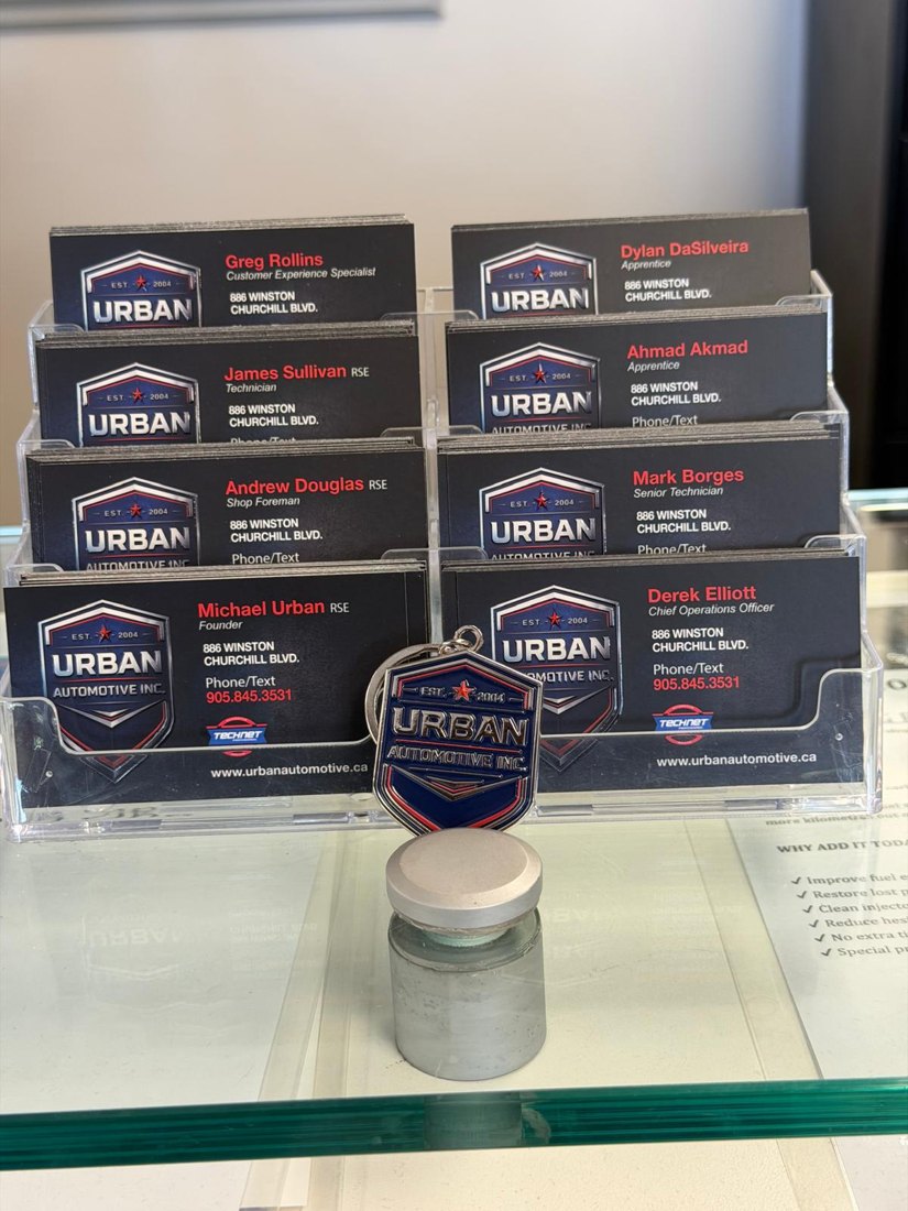 Urban Automotive team business cards, proudly local since 2004