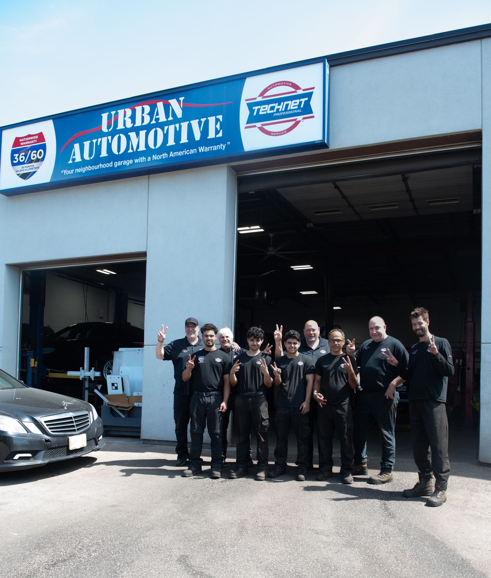 The family-run Urban Automotive team outside their Oakville shop